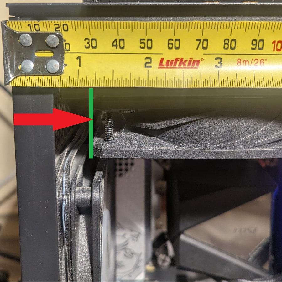 Measure the gap from the top-rear fan mount to the rear panel edge